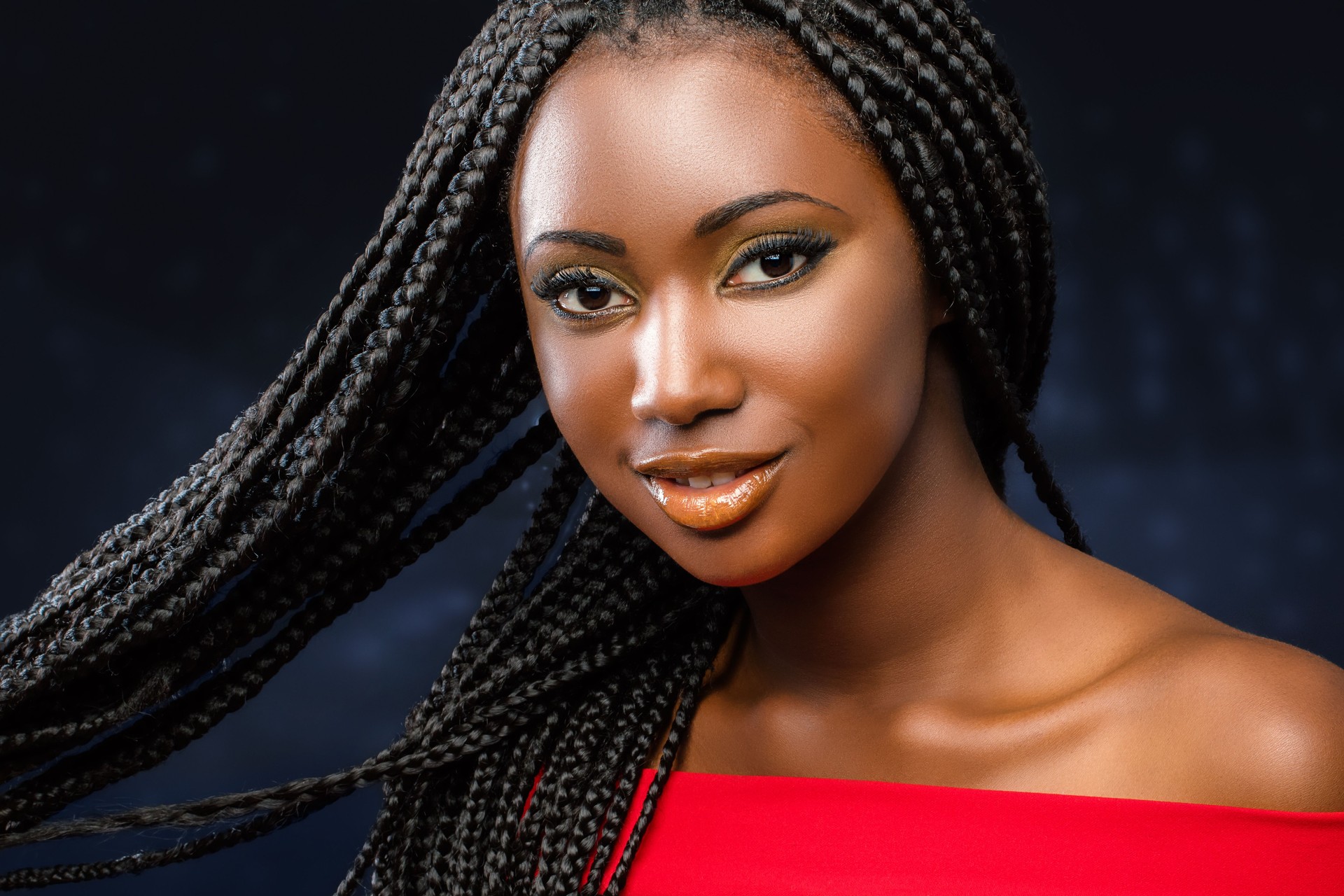 Cosmetic beauty portrait of young african girl with braids.